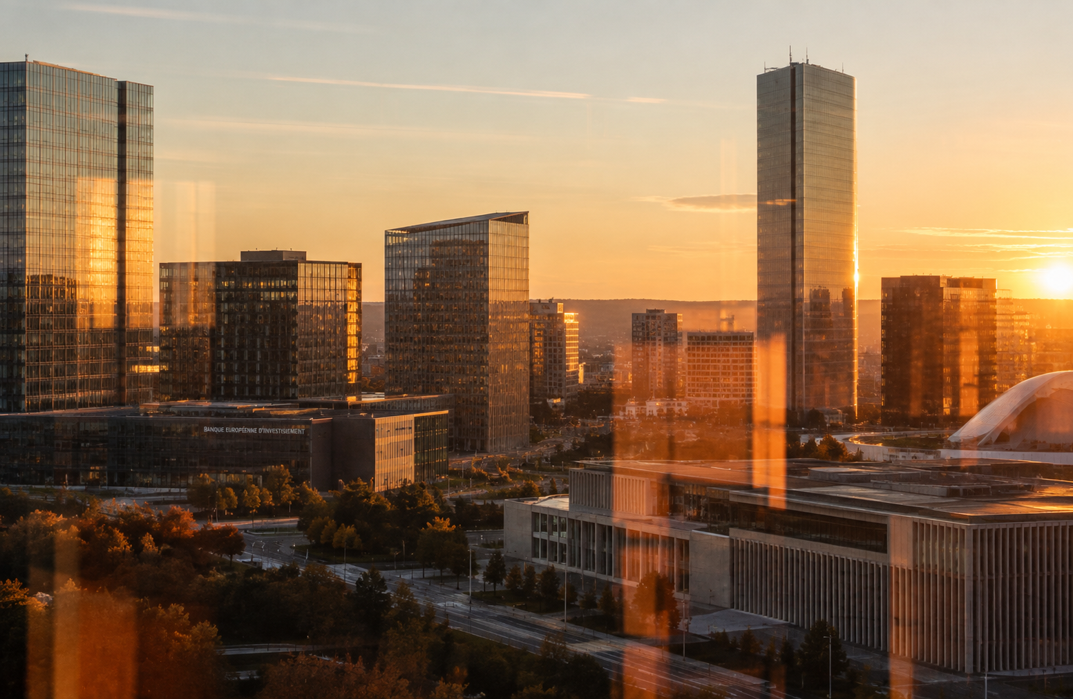 Luxembourg financial district viewed through office windows at sunset
